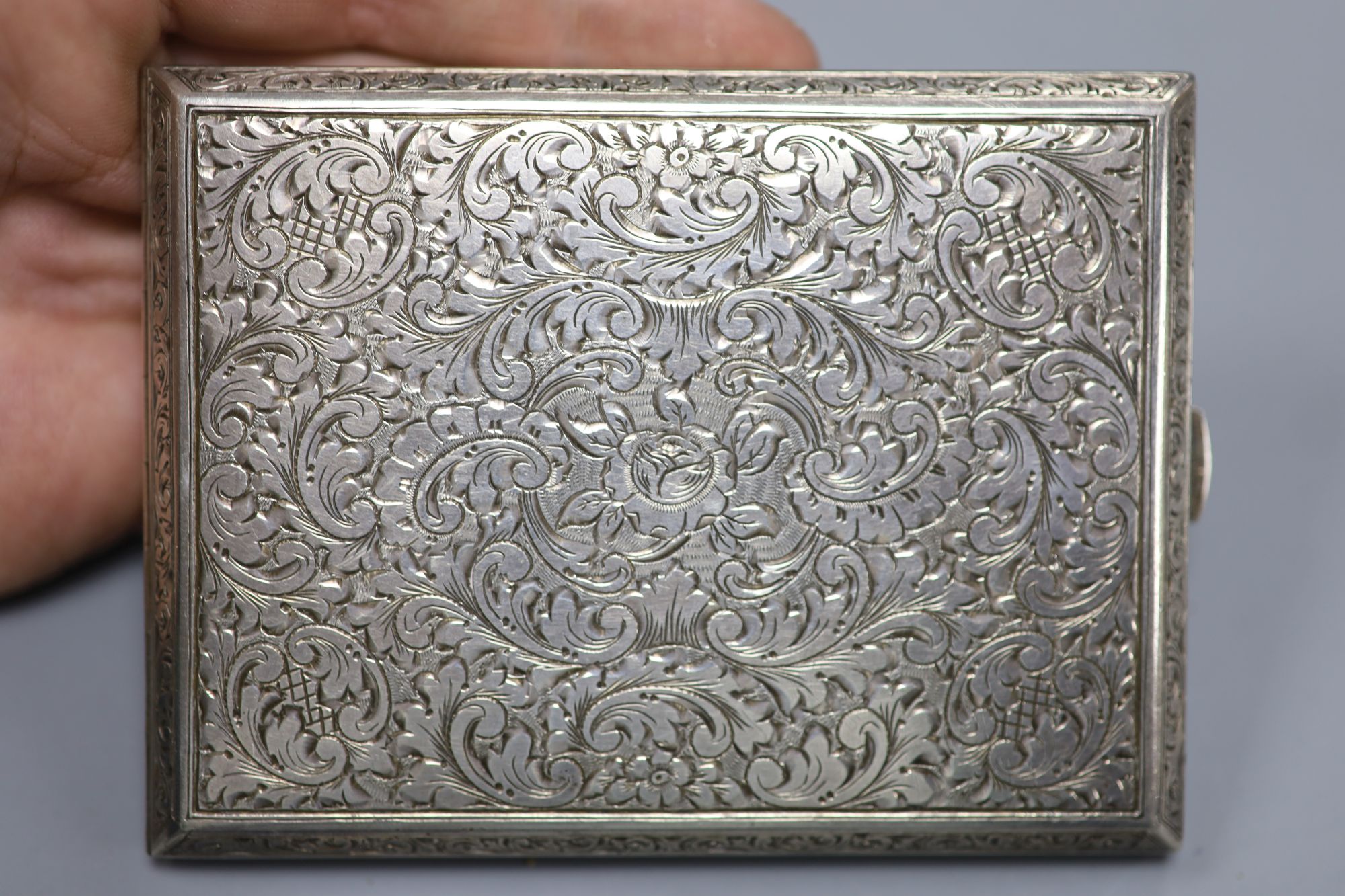 A 20th century Austrian engraved 900 standard white metal cigarette case, 10.3cm, gross 5oz.